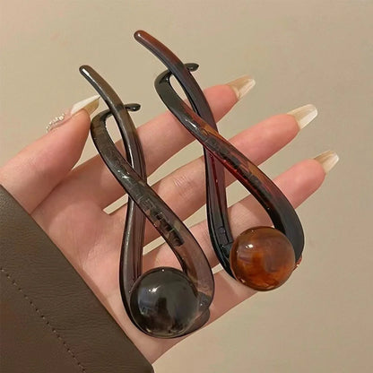 Elegante luxe haarclip met decoratieve bol